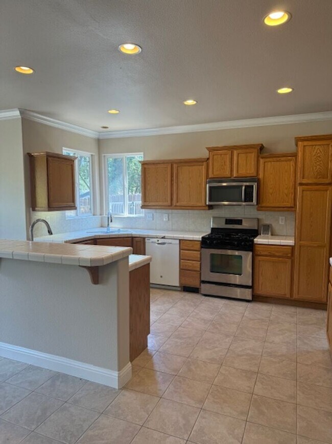 Building Photo - Enterprise Neighborhood 3 Bedroom Home with bonus room and 3 car garage- Landscaping Included!