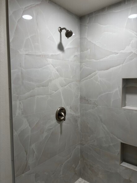 Primary shower has NEW tile & hardware. Toilet and shower are in private room with pocket door. - 8566 Larkhall Cir
