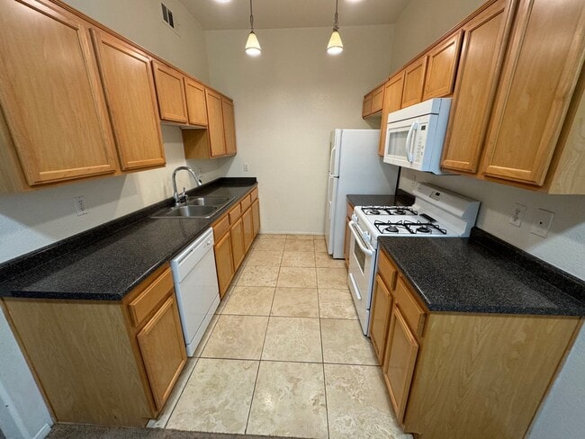 Building Photo - Green Valley: Spacious 3/2 Condo in Gated Community, with Pool/Spa, Fitness Center