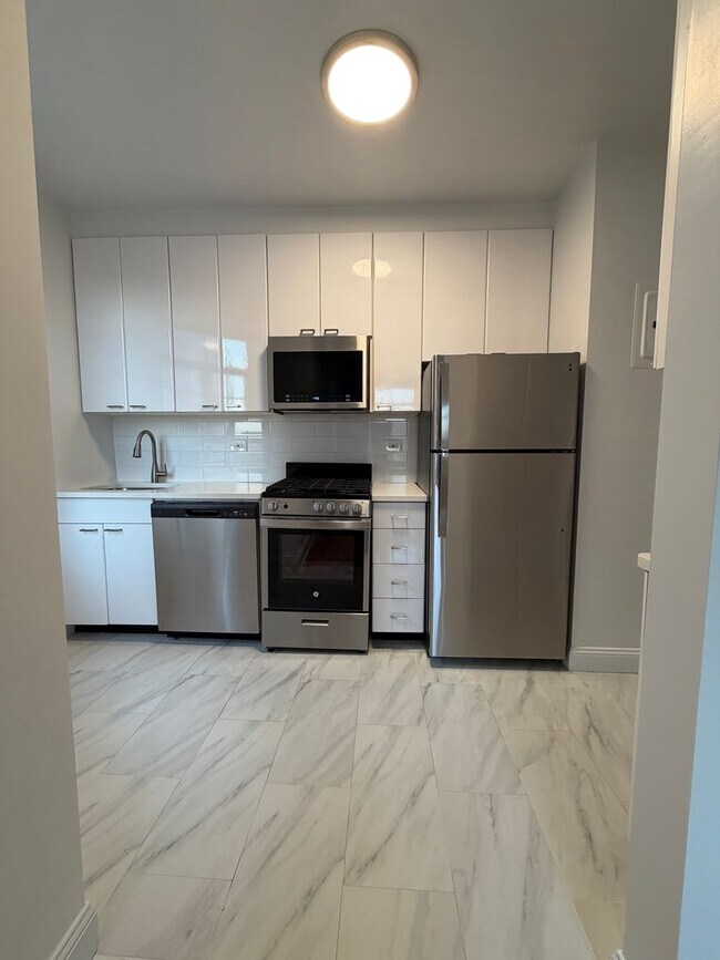 Building Photo - The Leslie — A Private Garden Enclave for the Modern New Yorker