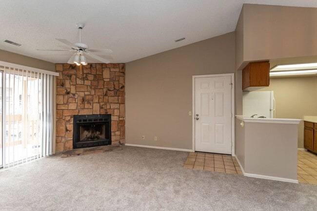 Building Photo - Cozy 2-Bed Condo with Fireplace, Garage & Pool Access Near Shopping!
