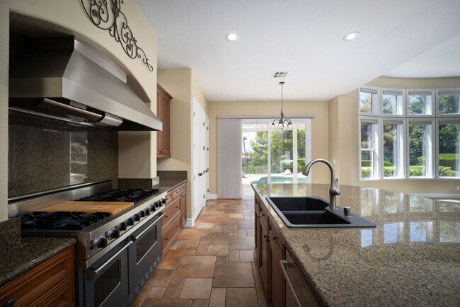 Entertain in this professional chefs kitchen with Sub-Zero and Viking adjacent to the great room. - 2850 Bronzino Ct
