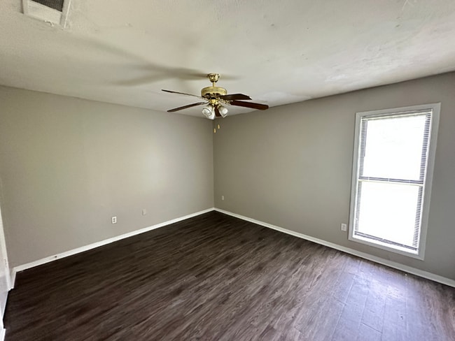 Building Photo - Charming 3BR/2BA Near Southwind | Soaring Vaulted Ceilings, Rustic Fireplace & Garage