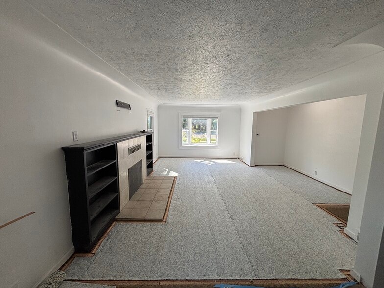 Living room. New carpet being installed now! - 917 S Division St