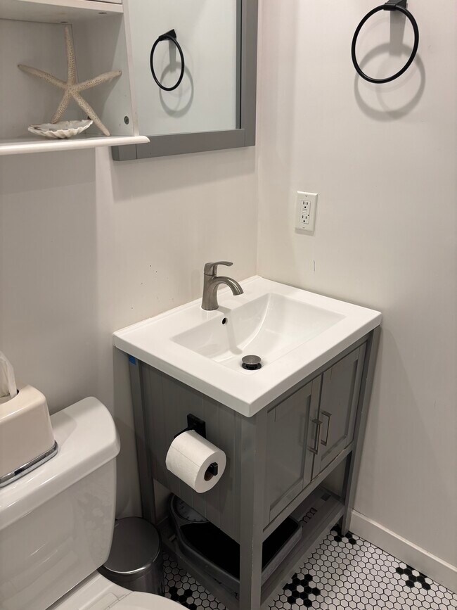 Bathroom cabinet and sink - 202 39th St