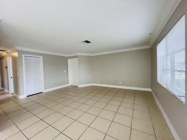 Building Photo - Updated 2-bedroom waterfront duplex with walk-in closets, enclosed Florida room, and canal views ...