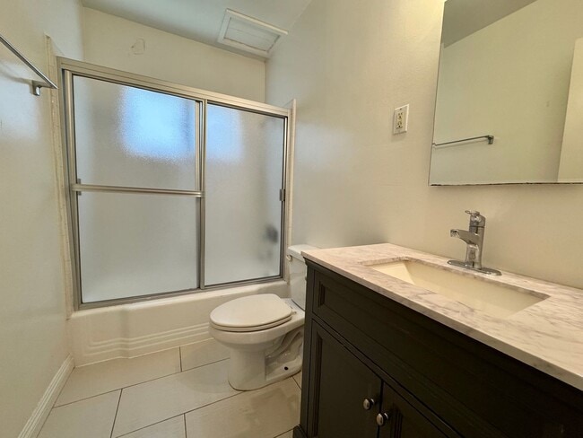 Building Photo - Updated Lower apartment with Hardwood Floo...