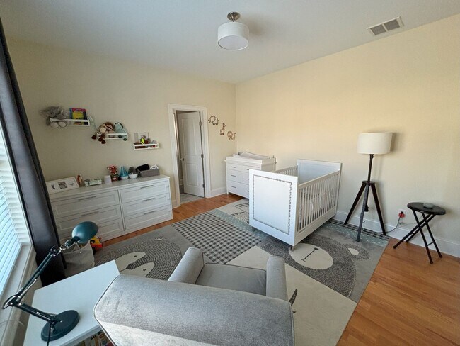 Main floor, bedroom with full bath attached and a closet. Hardwood floors. - 140 Wells View Rd