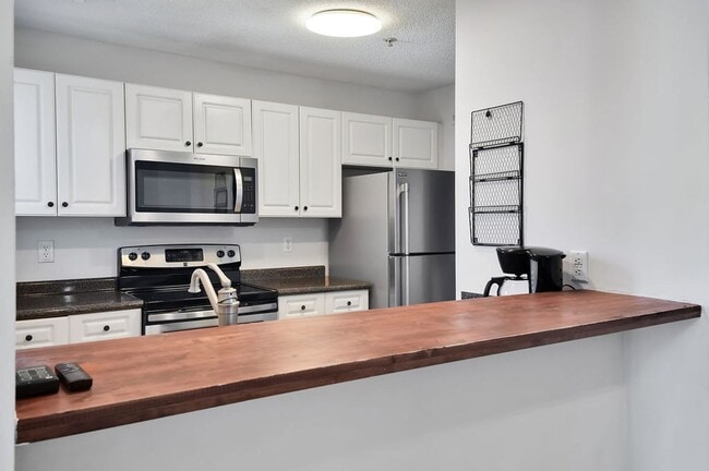 Building Photo - RENT SPECIAL! Freshly Painted! New Luxury ...