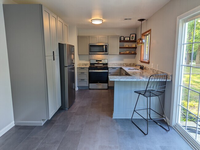 Pull up to the eat-in bar. - 2008 E Huntsville Rd