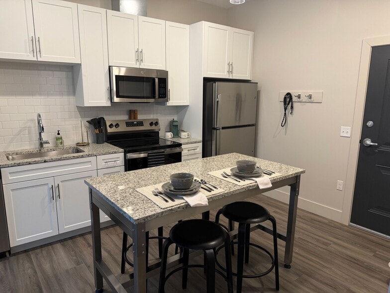 Kitchen and dining with thoughtful details - Triton at the Flats