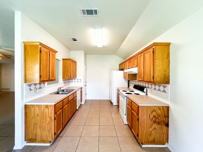 Building Photo - Available NOW!!!! Open floor plan features living room with fireplace, dining area, and large kit...