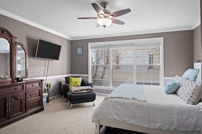 Building Photo - This inviting two-level townhome offers comfort and style, featuring gleaming hardwood floors on ...