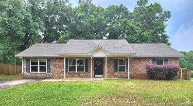Building Photo - This Spacious House Boasts 4 Bright and Ai...