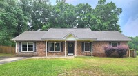 Building Photo - This Spacious House Boasts 4 Bright and Ai...