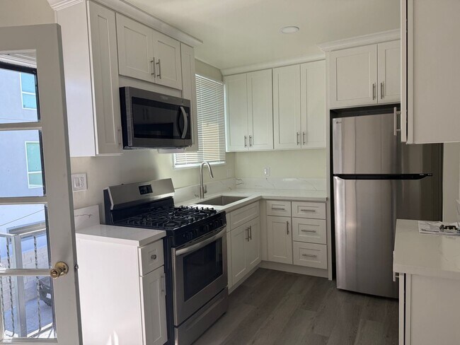 Building Photo - FOR RENT — COMPLETELY REMODELED Apartment