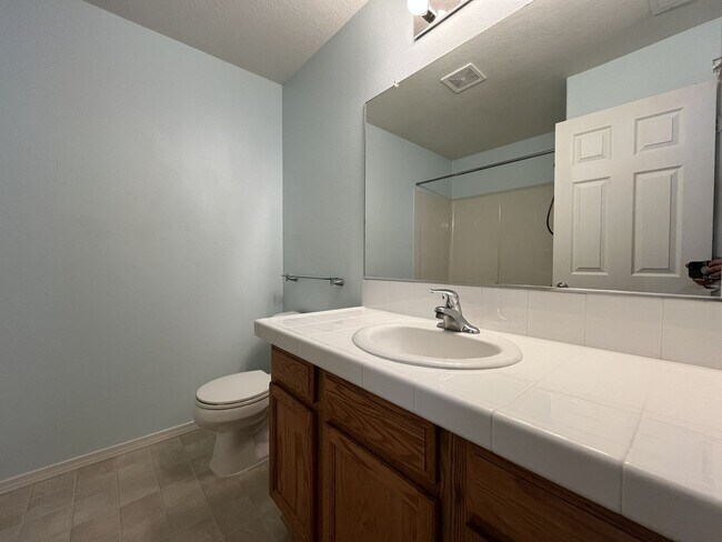 Building Photo - Inviting Two-Story 3BR Home Featuring Gas Range, Walk-In Closet, and Built-In Deck Seating