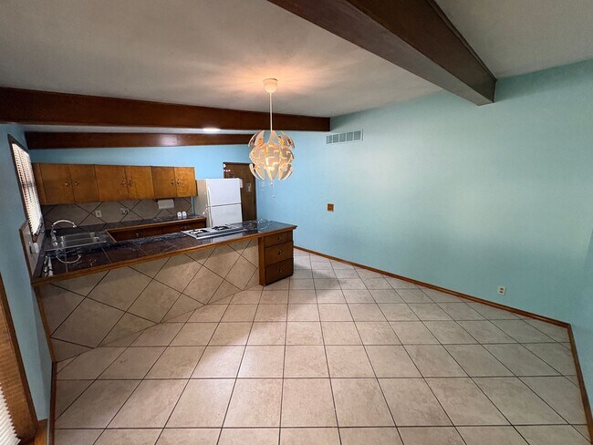 Building Photo - Spacious Home with Attached Garage & Fenced Backyard