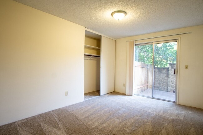 Building Photo - Garden-Level 2 Bed 2 Bath with Large Patio, Parking, & W/D Hookups