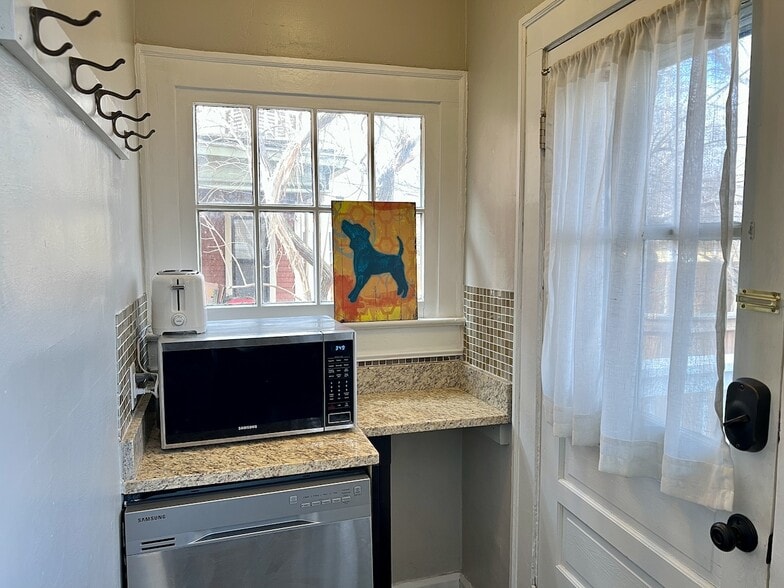 Dishwasher, microwave, coffee maker, and toaster. - 232 E 10th St