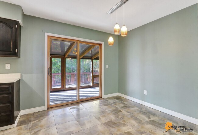 Building Photo - Eagle River Home w/ Fenced Yard, Sunroom, and Garage!