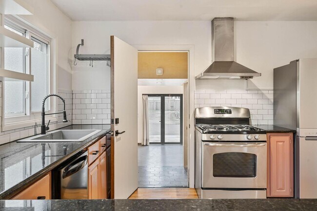 Building Photo - Beautiful, modern 4-bdrm/2-bath home in Concordia—Private, urban sanctuary w/ flex spaces