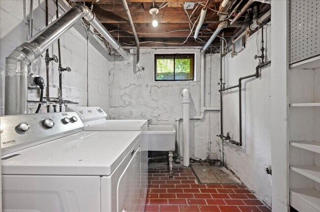 Building Photo - Elegant Multi-Level Brick Residence with Outdoor Oasis