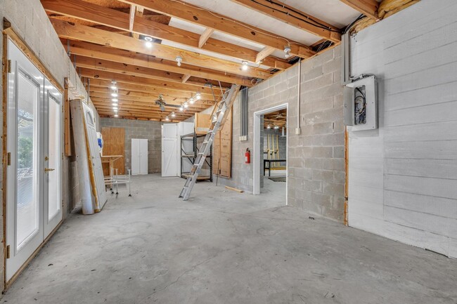 Building Photo - Charming home with large garage & attached...