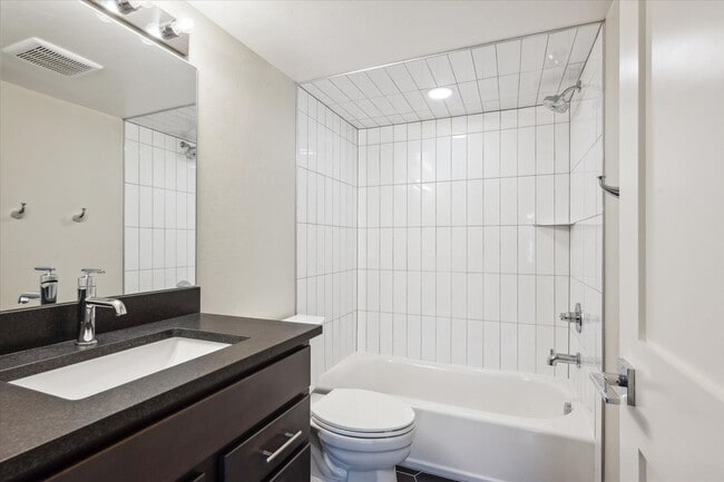 Building Photo - Modern 4-Bedroom Townhome with Rooftop Deck Near Sloan’s Lake & Light Rail
