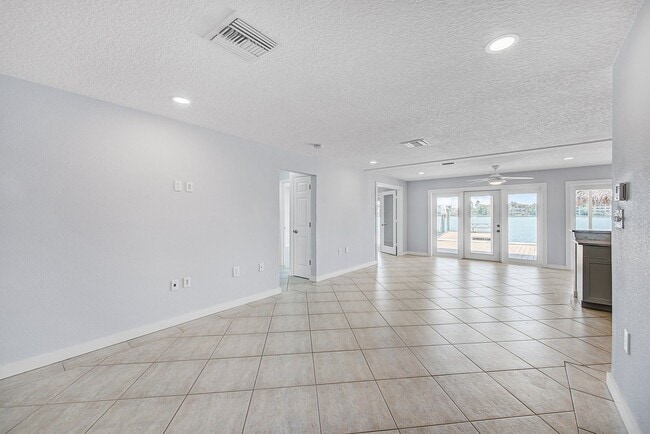 Building Photo - Waterfront 3BR/2BA Home – Walk to Beach + Boat Lift – $500 Off!