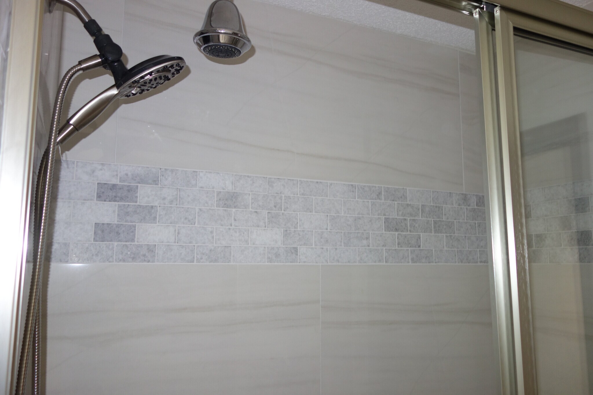 Shared bathroom updated shower/tub combo with dual heads - 3324 E 73rd St