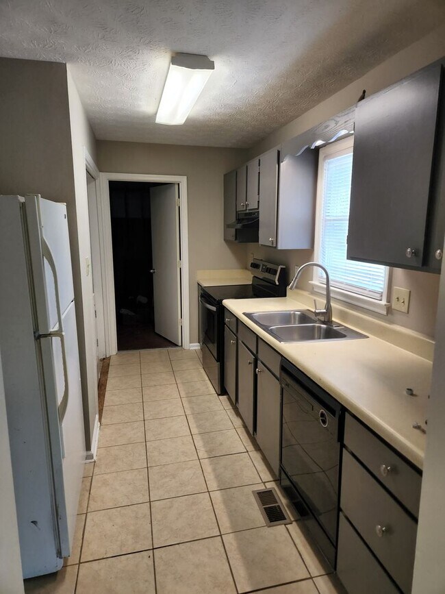 Building Photo - The Best of North Metro Living without the...