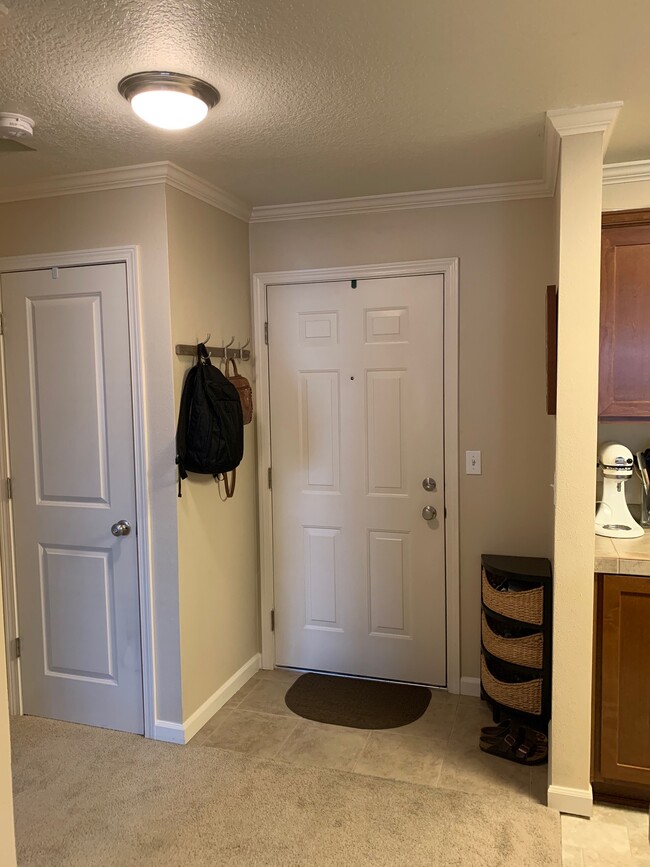 Closet door on the left & Front door on right - 15058 NW Central Dr