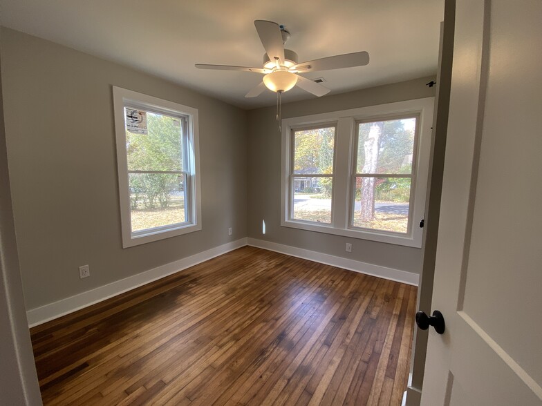 Front bedroom, huge closet, refinished original hardwoods, ceiling fan, USB, USBC - 1524 Ward Ave NE