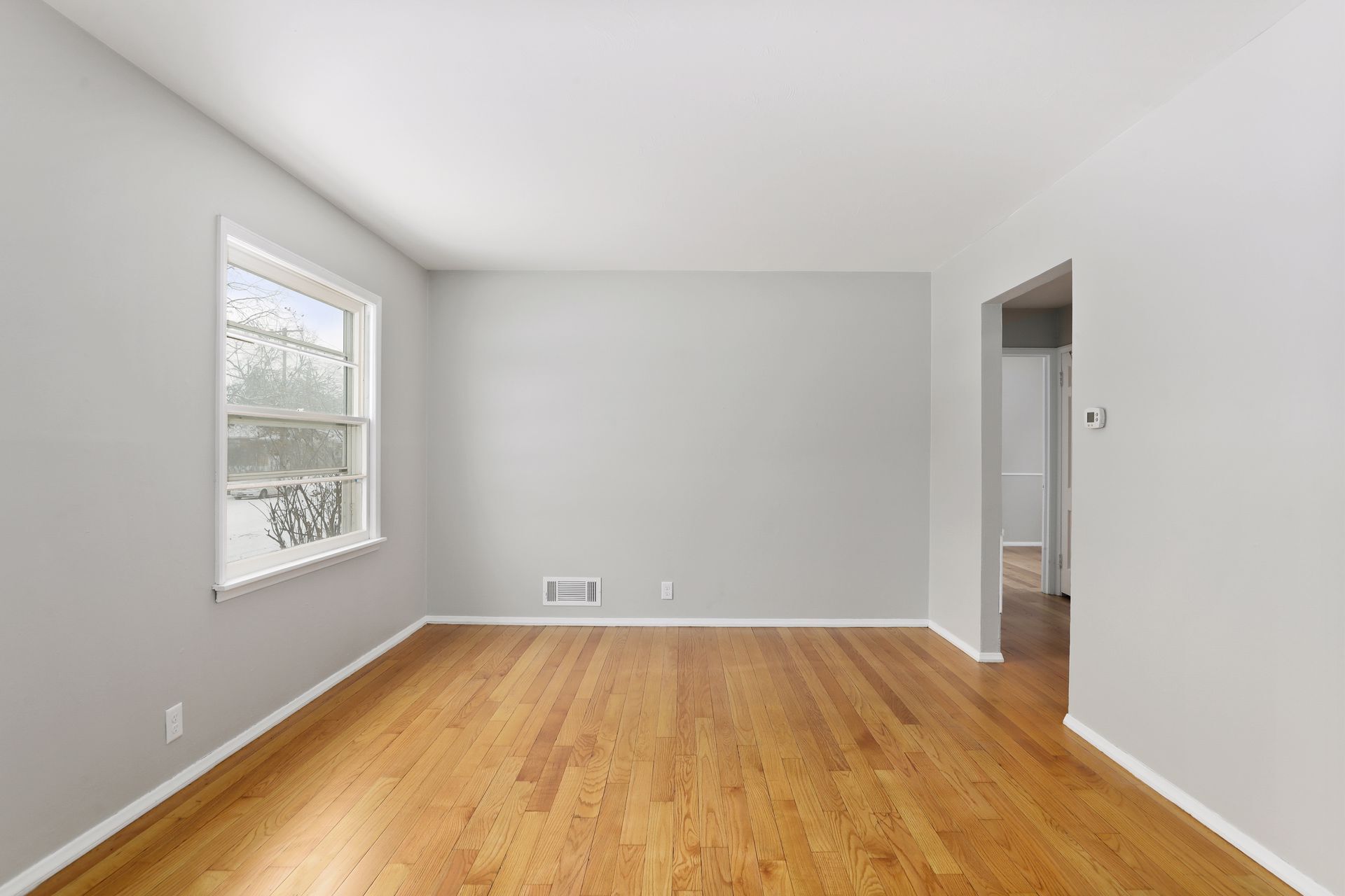 Living room and entry to kitchen and bedrooms - 1395 Taylor Ave W