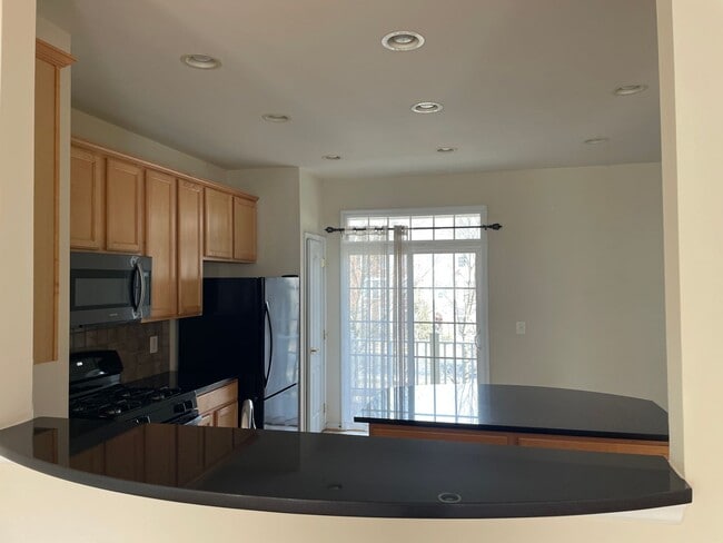 Building Photo - Stunning Light-Filled 3 Bed 2/2 Bath Townhome In Sought After Brambleton