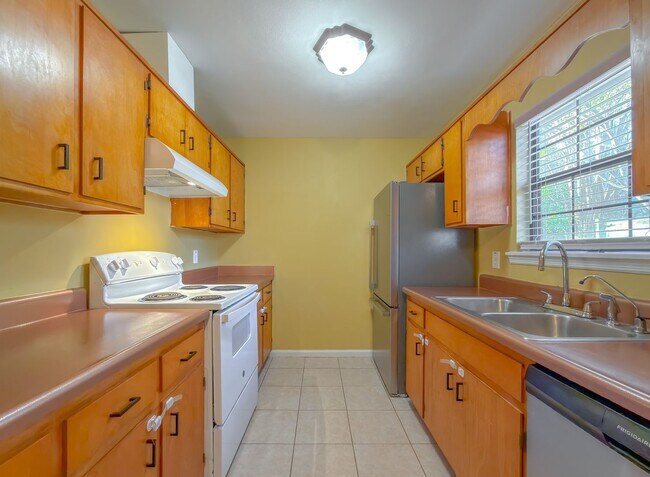 Building Photo - LOVELY & Modern NW 2/1 w/ New Flooring & Huge Privacy Fenced Yard that Inc Lawn Maintenance! Avai...