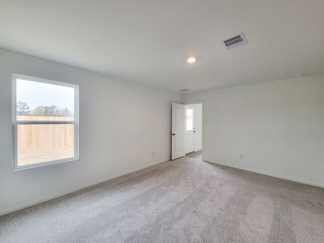 Building Photo - This great new single-story design makes smart use of the space available. At the front are all t...