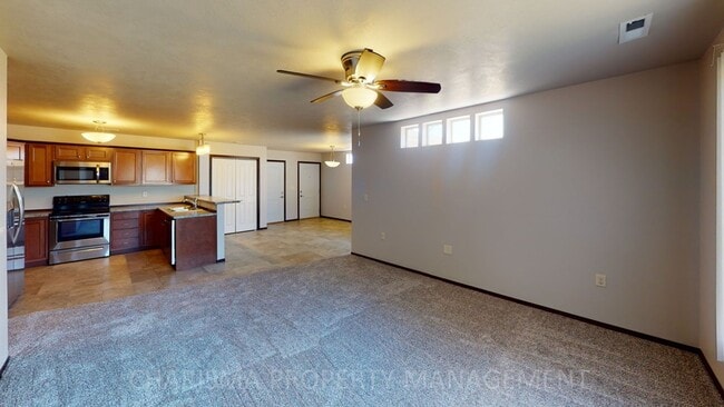 Building Photo - LOWER LEVEL 3 BEDROOM, 2 BATH TOWN HOME, INDIVIDUAL ENTRANCE, DOUBLE ATTACHED GARAGE, PET FRIENDLY