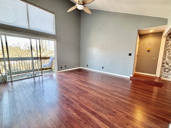 Building Photo - Top-Floor Plaza Condo with Vaulted Ceilings & Dual Balconies