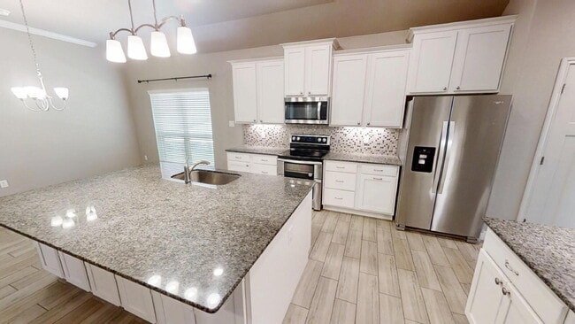 Building Photo - "Charming 4-Bedroom Retreat with Granite E...