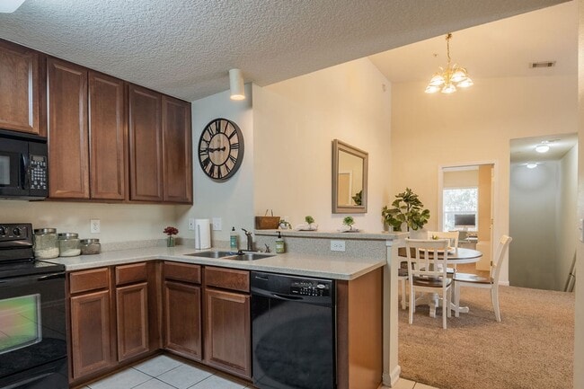 Building Photo - Heron's Landing End Unit Overlooking the Sparkling Community Pool