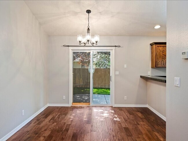Building Photo - June Rent Free!!  Move Today!  Four Bedroom, Three Bath Home with Beautiful Backyard, Two Car Gar...