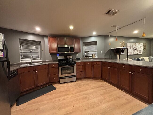 Large kitchen with plenty of cabinet and storage space - 4871 N Magnolia Ave