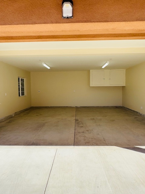 Two car garage with storage cabinets - 1109 W Angeleno Ave