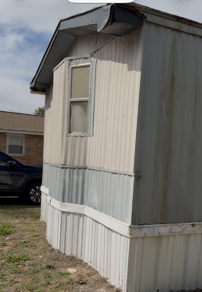 Building Photo - Handyman Special – Land + Home (Rent-to-Own)