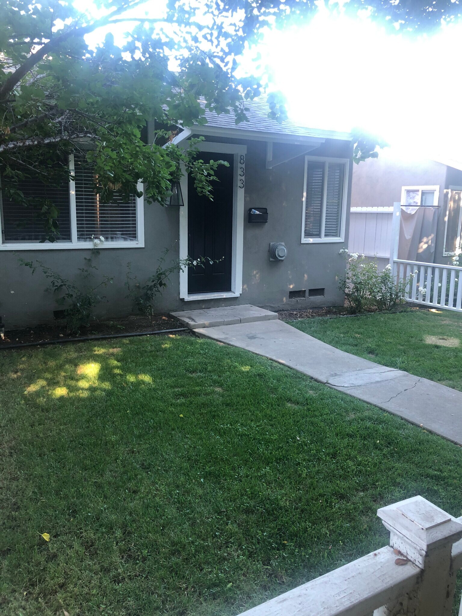Entry door and private front lawn - 827 E Washington Blvd