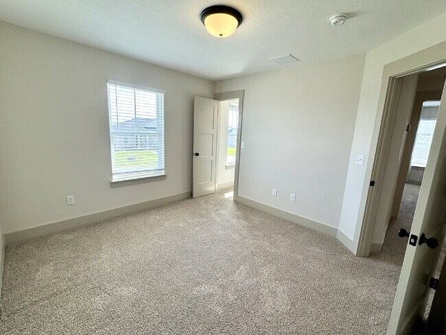 Building Photo - Need Space?  How about 5 bedrooms, 2.5 baths + an extra bonus area upstairs so that the kids can ...