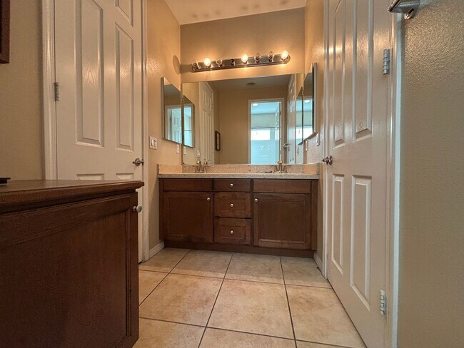 Building Photo - Grand 4-Bedroom Home with Entertainer's Yard in Gated River Village!