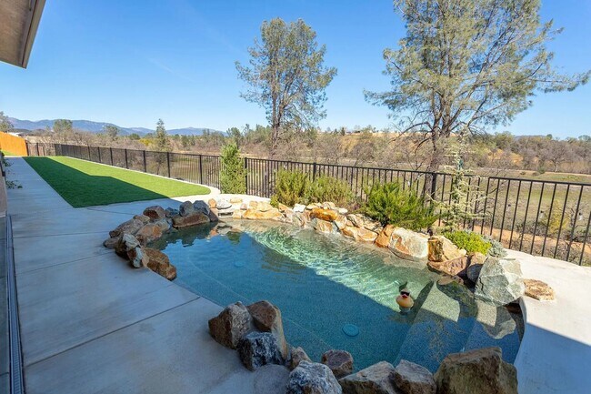 Building Photo - Custom Home with Solar, a Pool & all the Upgrades...in Town...Must See!